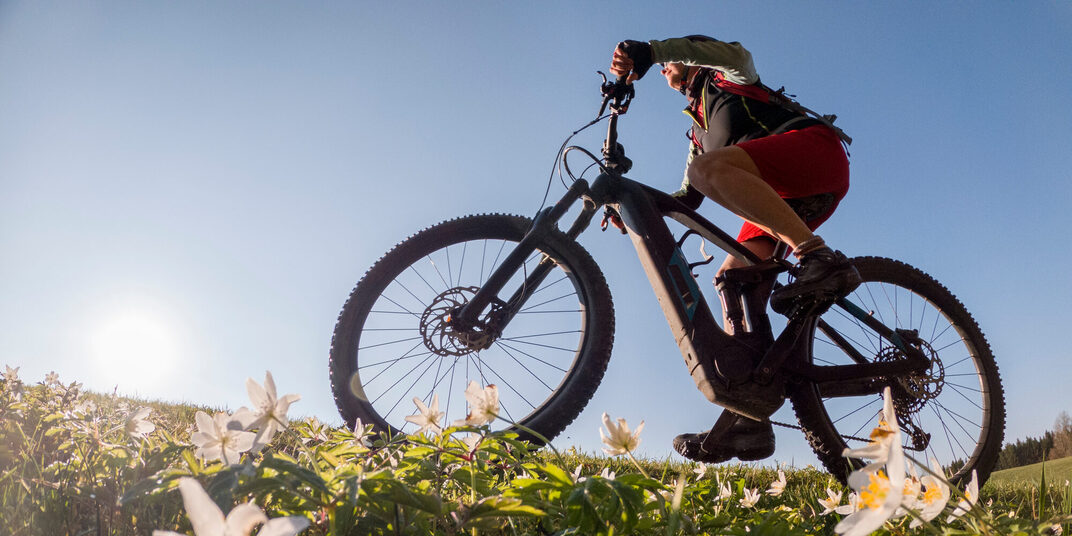Pretty,Senior,Woman,Riding,Her,Electric,Mountain,Bike,In,Early